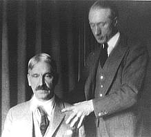 F. Matthias Alexander giving John Dewey an Alexander Technique lesson.