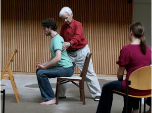 Alexander Technique teacher Alexander Murray givng a chair turn to teacher-trainee